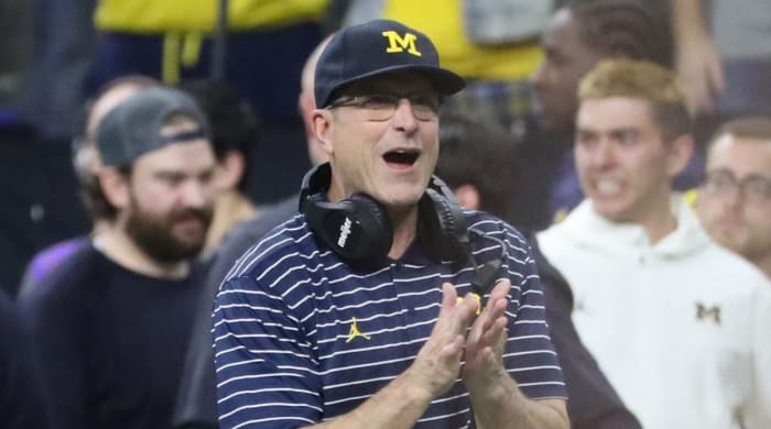 Michigan coach Jim Harbaugh celebrates 2022 Big Ten championship win
